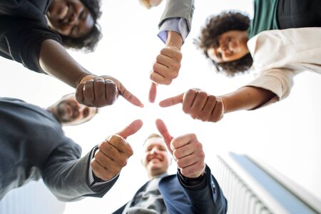 Business team thumbs up
