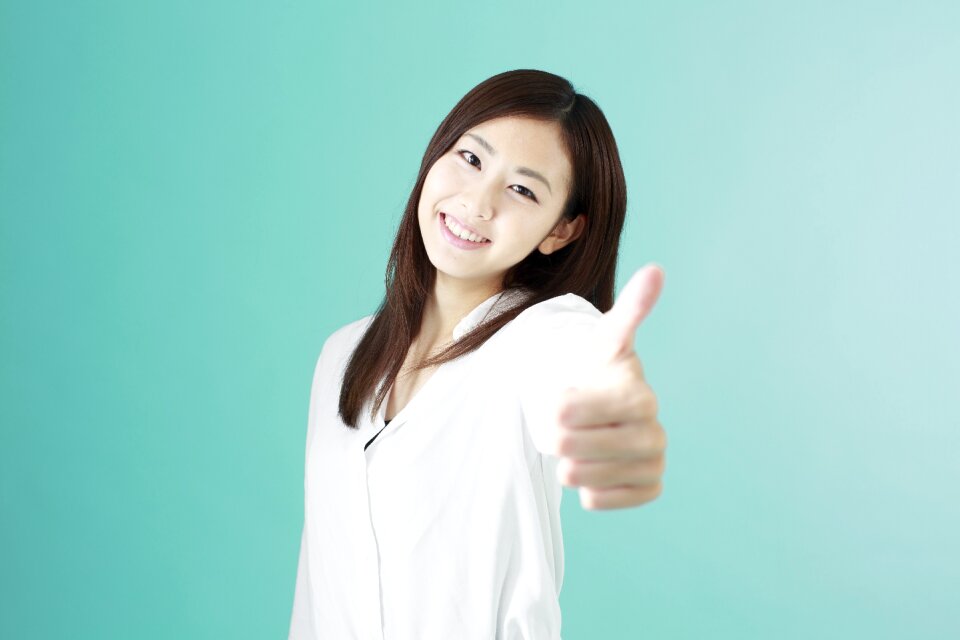 Business woman thumbs up