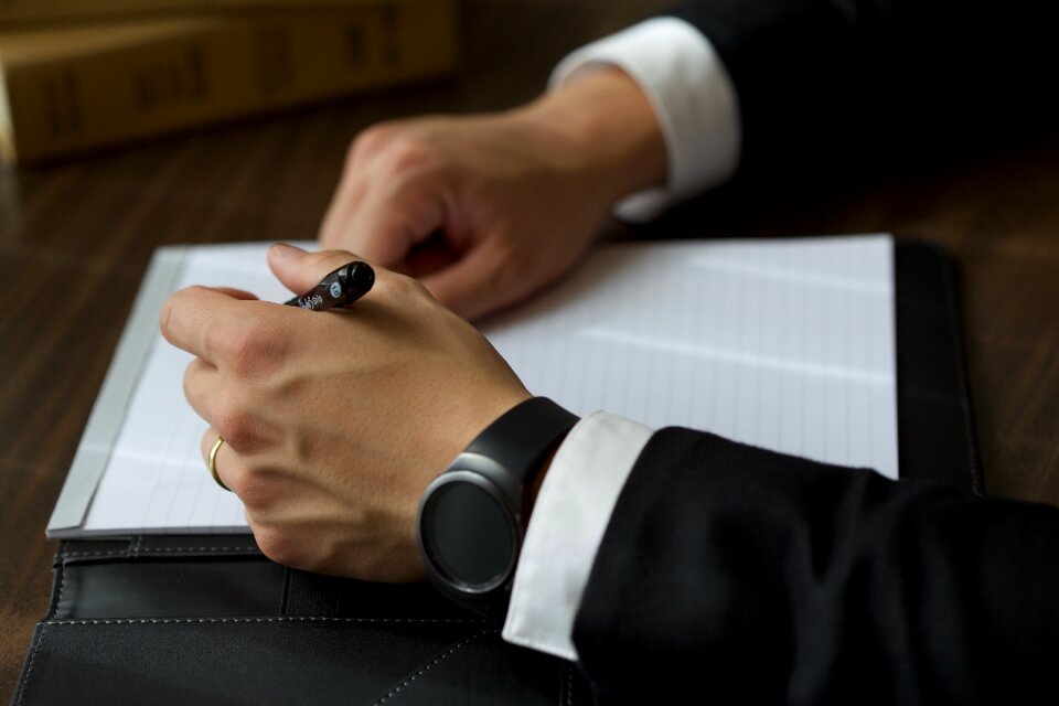 Businessman writing note