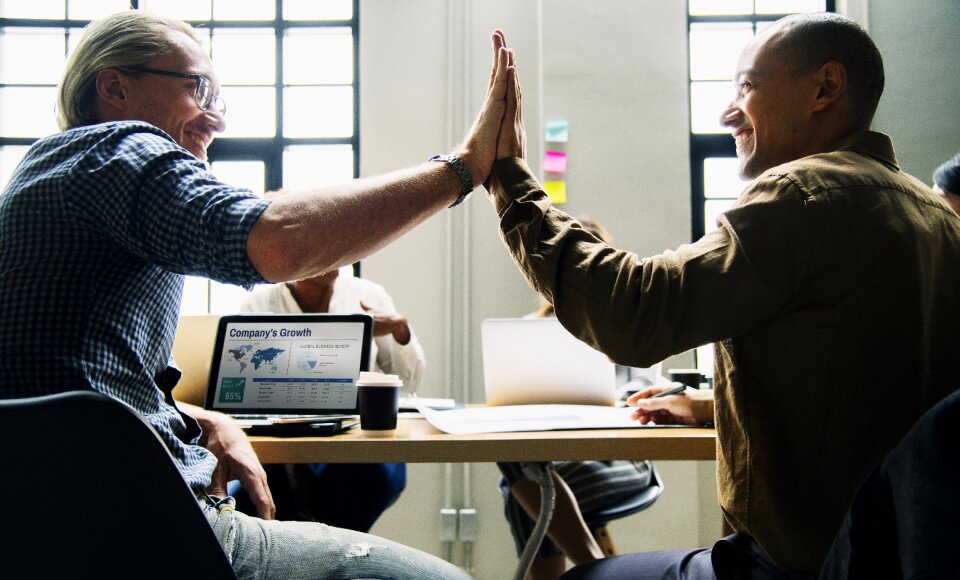 Businessmen high five