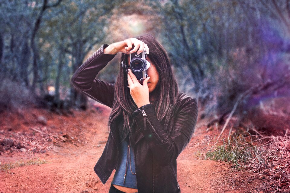 Camera taking picture woman
