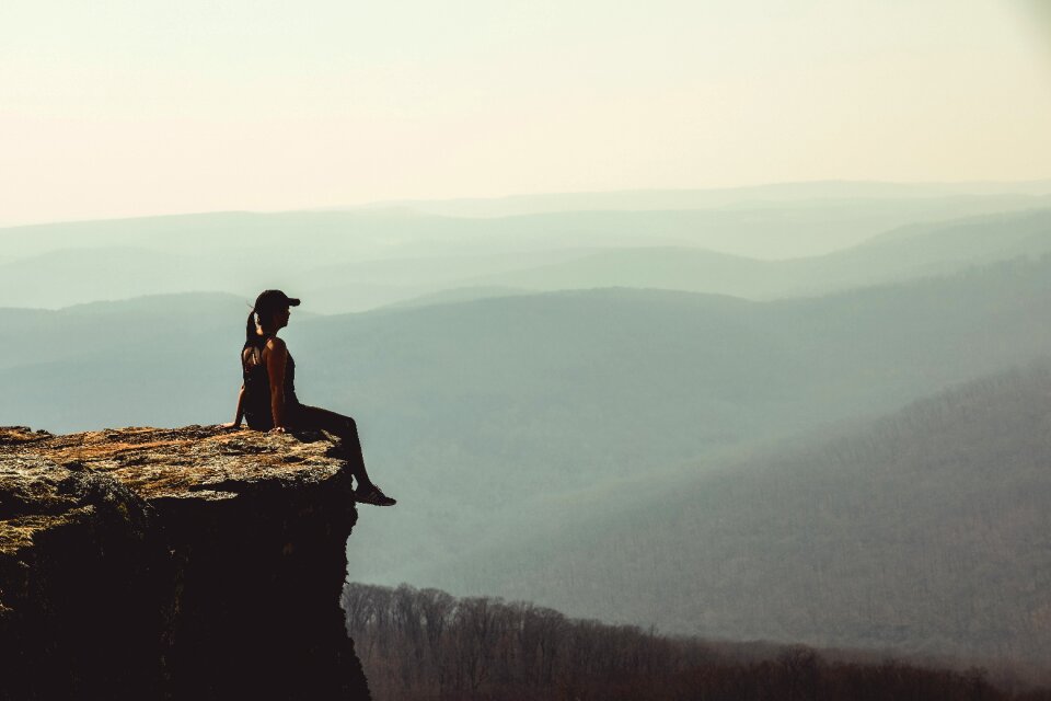 Cliff woman mountains photo