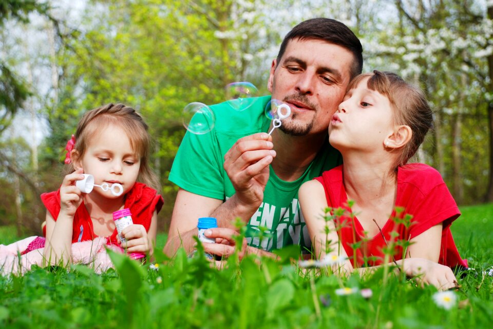Father daughters soap bubble