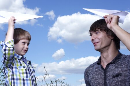 Father son paper airplane photo