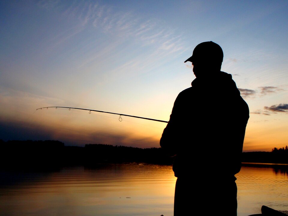 Fisherman sunset lake