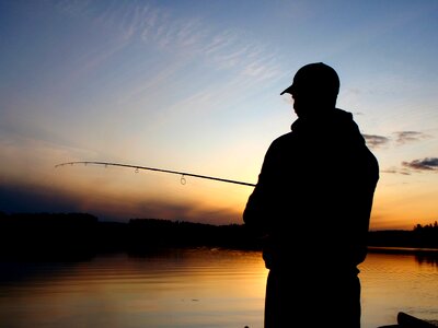 Fisherman sunset lake
