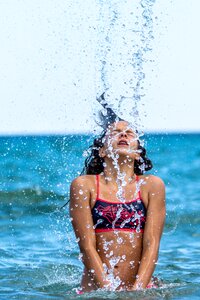 Girl sea bathing splash photo