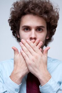 Man portrait coverd mouth