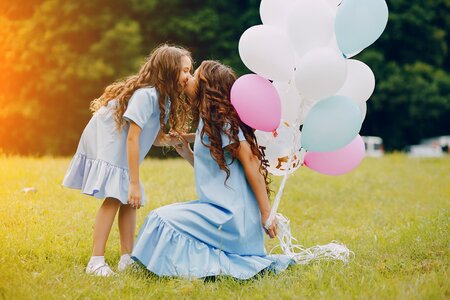 Mother daughter kiss