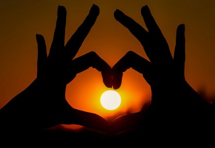 Sunset heart hands photo