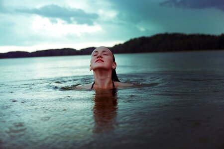 Woman bathing lake photo