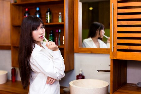 Woman girl brushing teeth