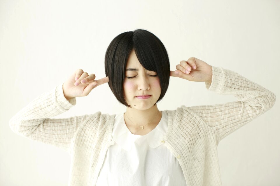 Woman girl cover ears