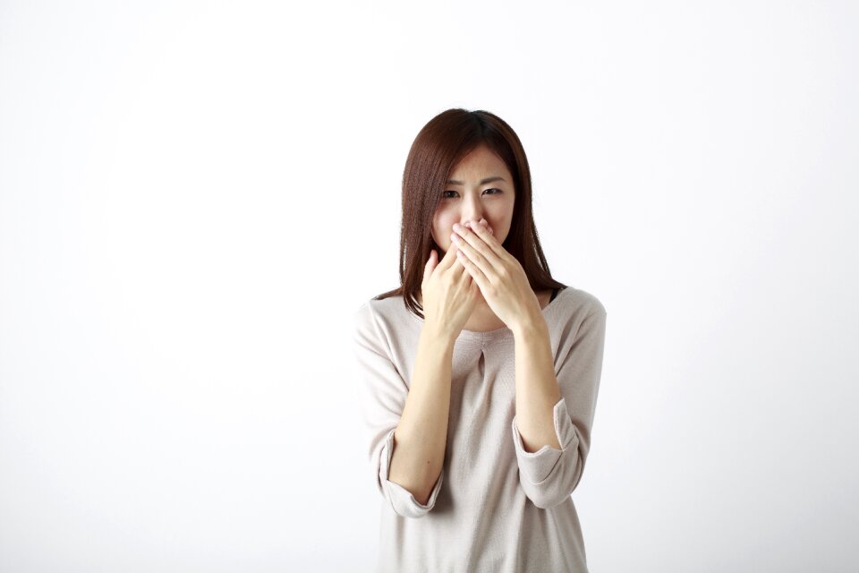 Woman girl cover mouth