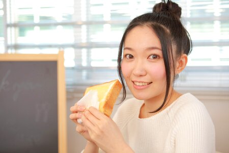 Woman girl eating toast photo