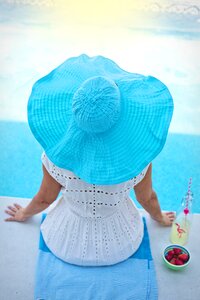 Woman poolside hat photo