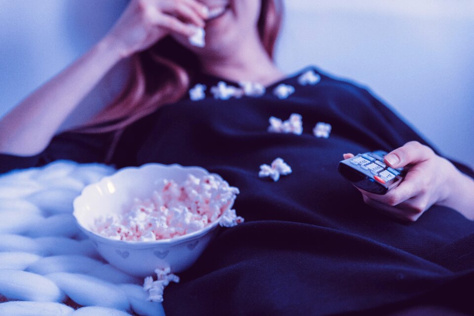 Woman popcorn remote controller