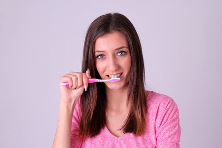 Woman toothbrush photo