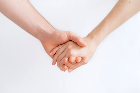 Couple holding hands