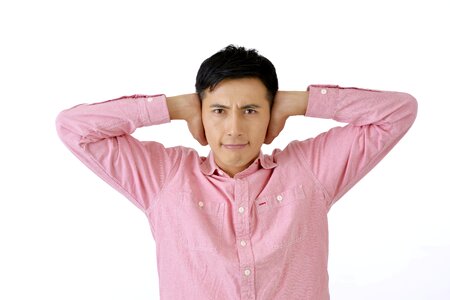 Man coverd ears