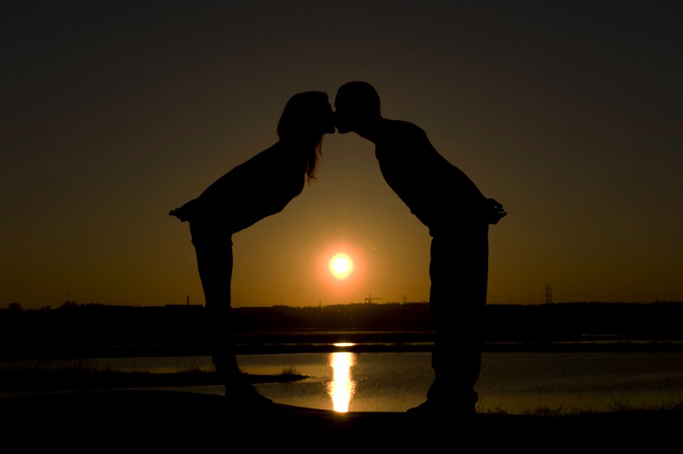 Sunset couple kiss