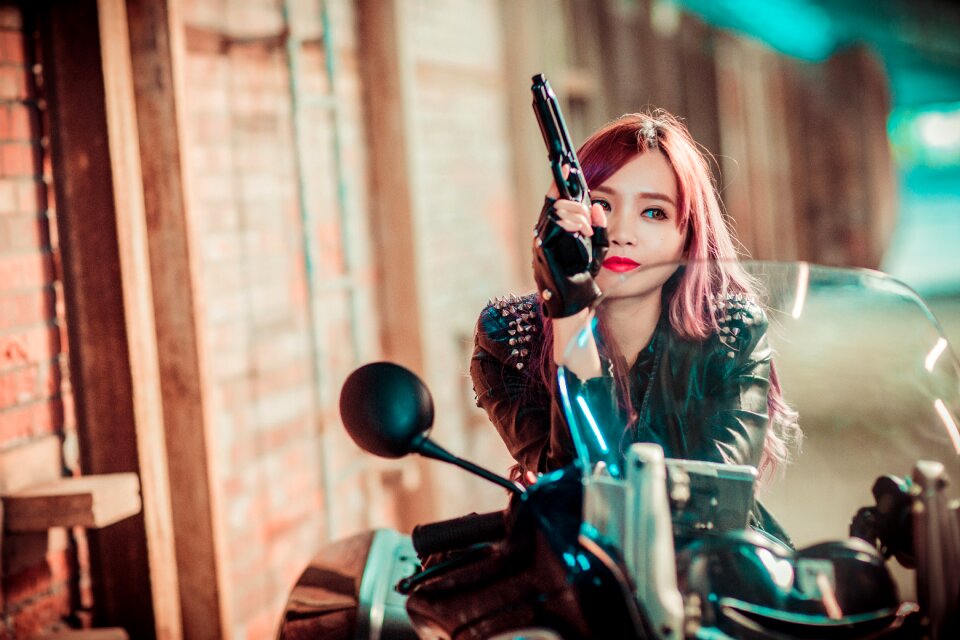 Woman motorcycle pistol photo