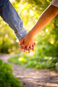Couple holding hands photo