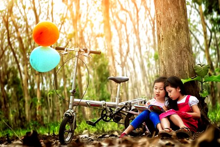 Bicycle girls reading book