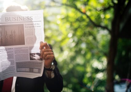 Business man reading newspaper photo