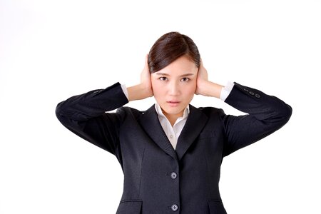 Business woman cover ears