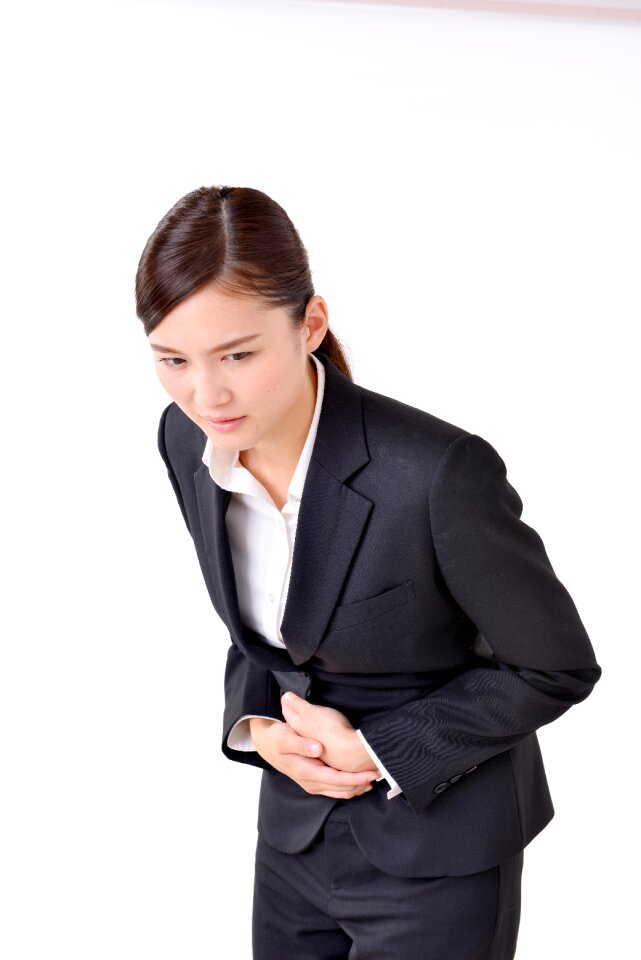 Business woman stomachache