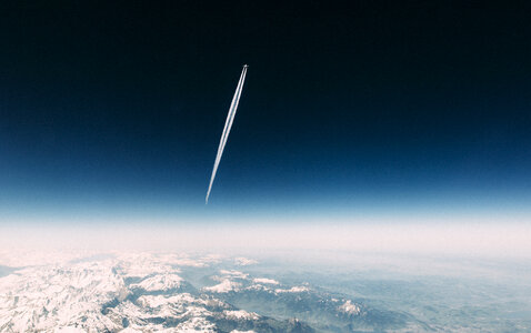 Contrail sky mountains