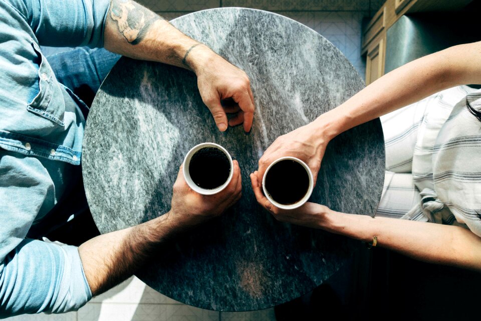 Couple hands coffee photo