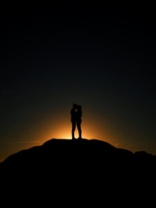 Couple kiss sunset photo