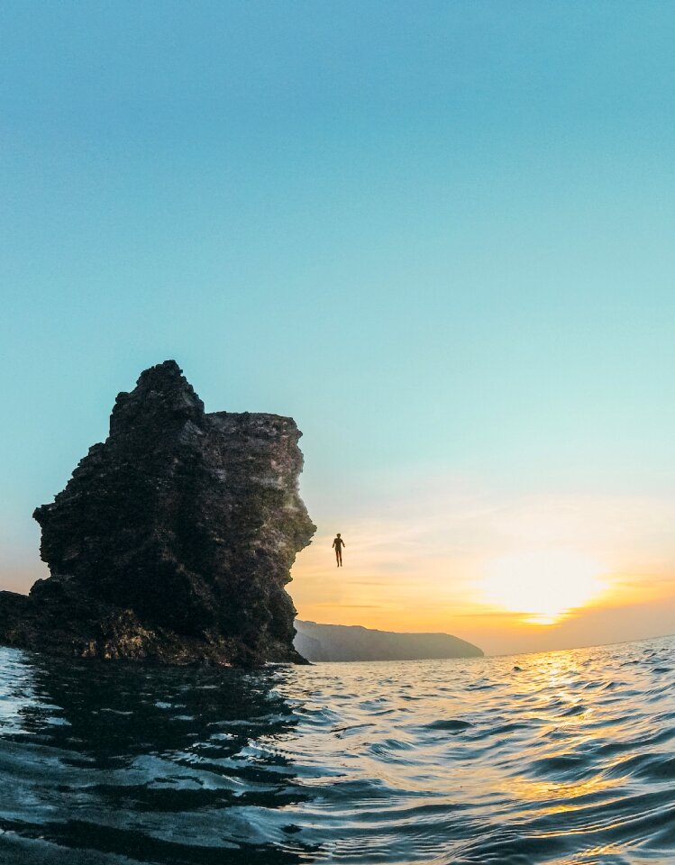 Sea rock dive sunset