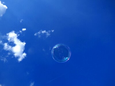 Soap bubble blue sky photo