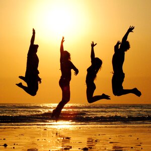 Sunset beach jump group photo