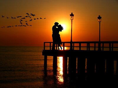 Sunset couple kiss photo