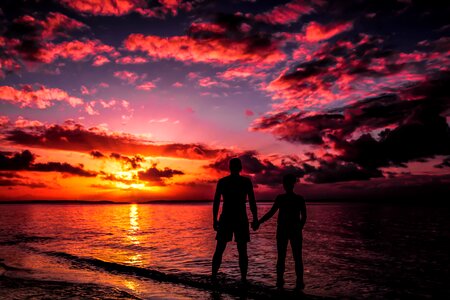 Sunset sea couple photo