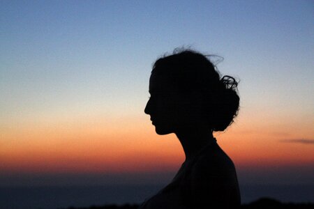 Sunset woman profile silhouette photo