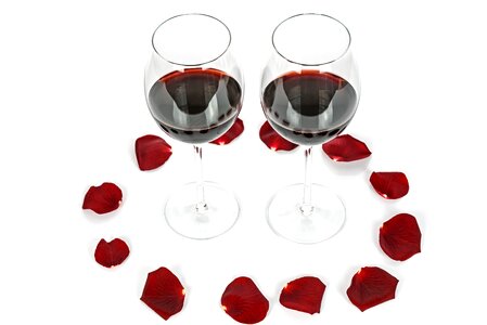 Wine glasses rose petals
