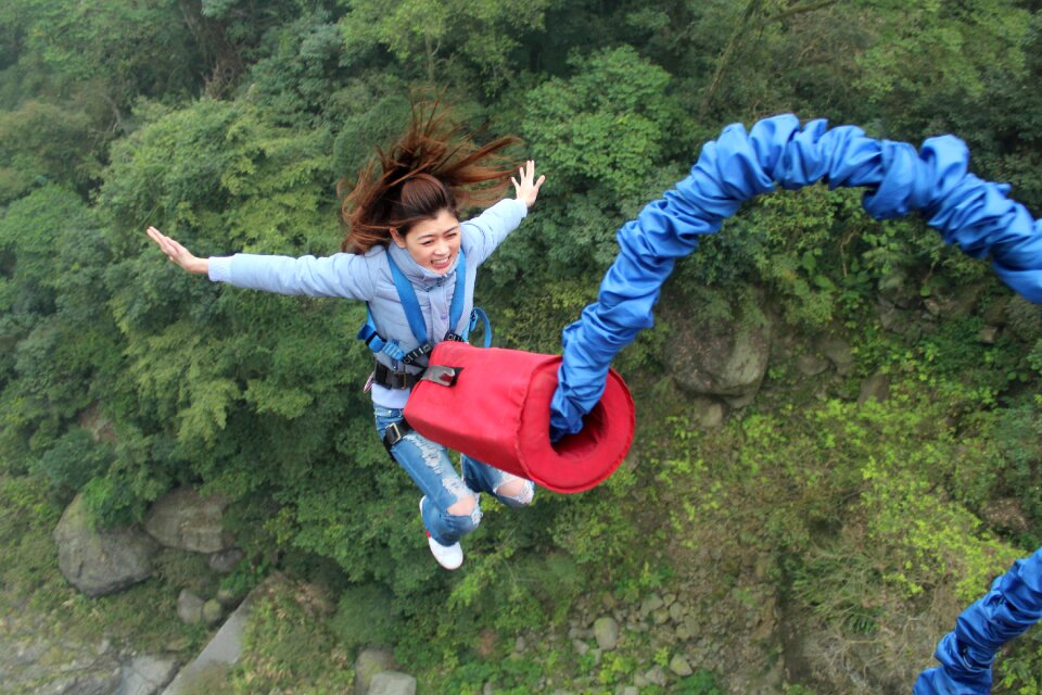 Woman bungee jumping