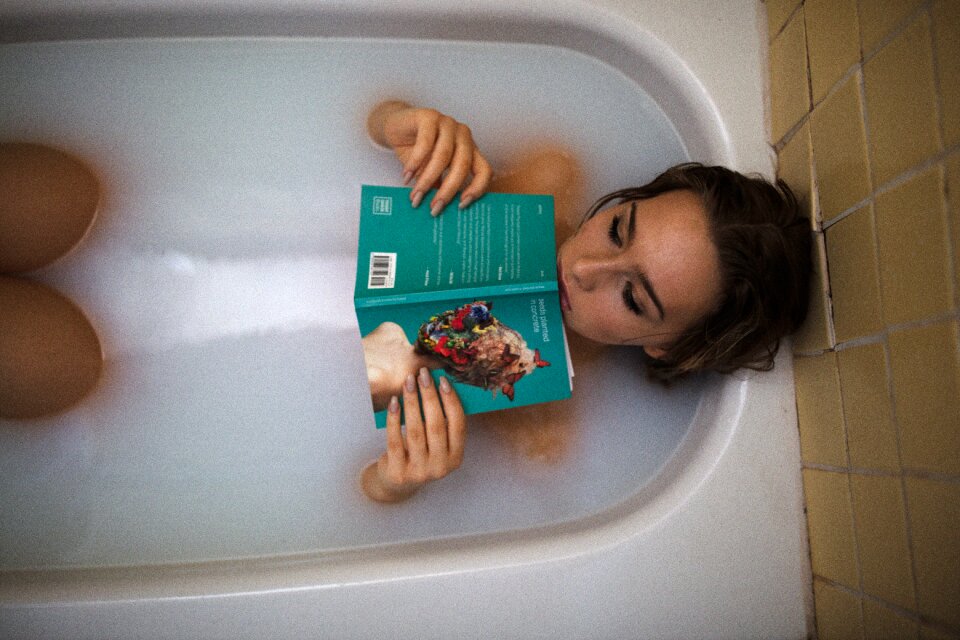 Woman girl bathing book