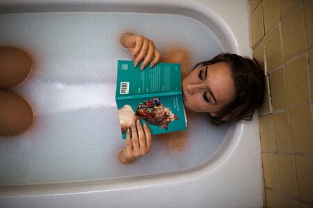 Woman girl bathing book