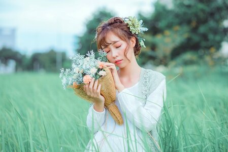 Woman girl grass bouquet photo