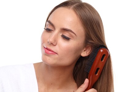 Woman girl hair brushing photo