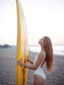 Woman girl swimwear surfboard