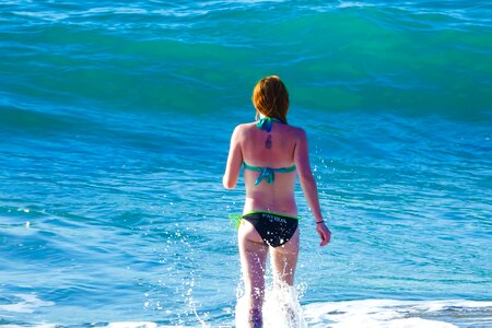 Woman sea bathing photo
