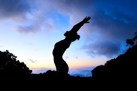 Woman silhouette yoga stretching photo