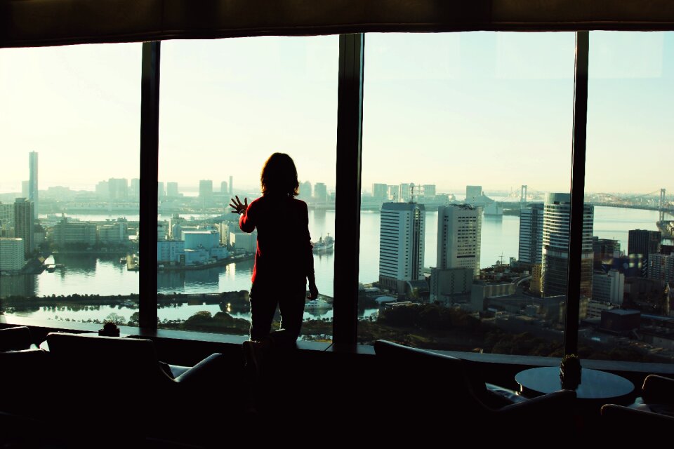 Woman window cityscape